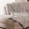 Plaid-Namibia-Bruin-katoen-over-bank Plaid Namibia bruin - Premium Belmarti® kwaliteit