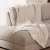Plaid-Namibia-Taupe-katoen-over-bank Plaid Namibia taupe - Premium Belmarti® kwaliteit